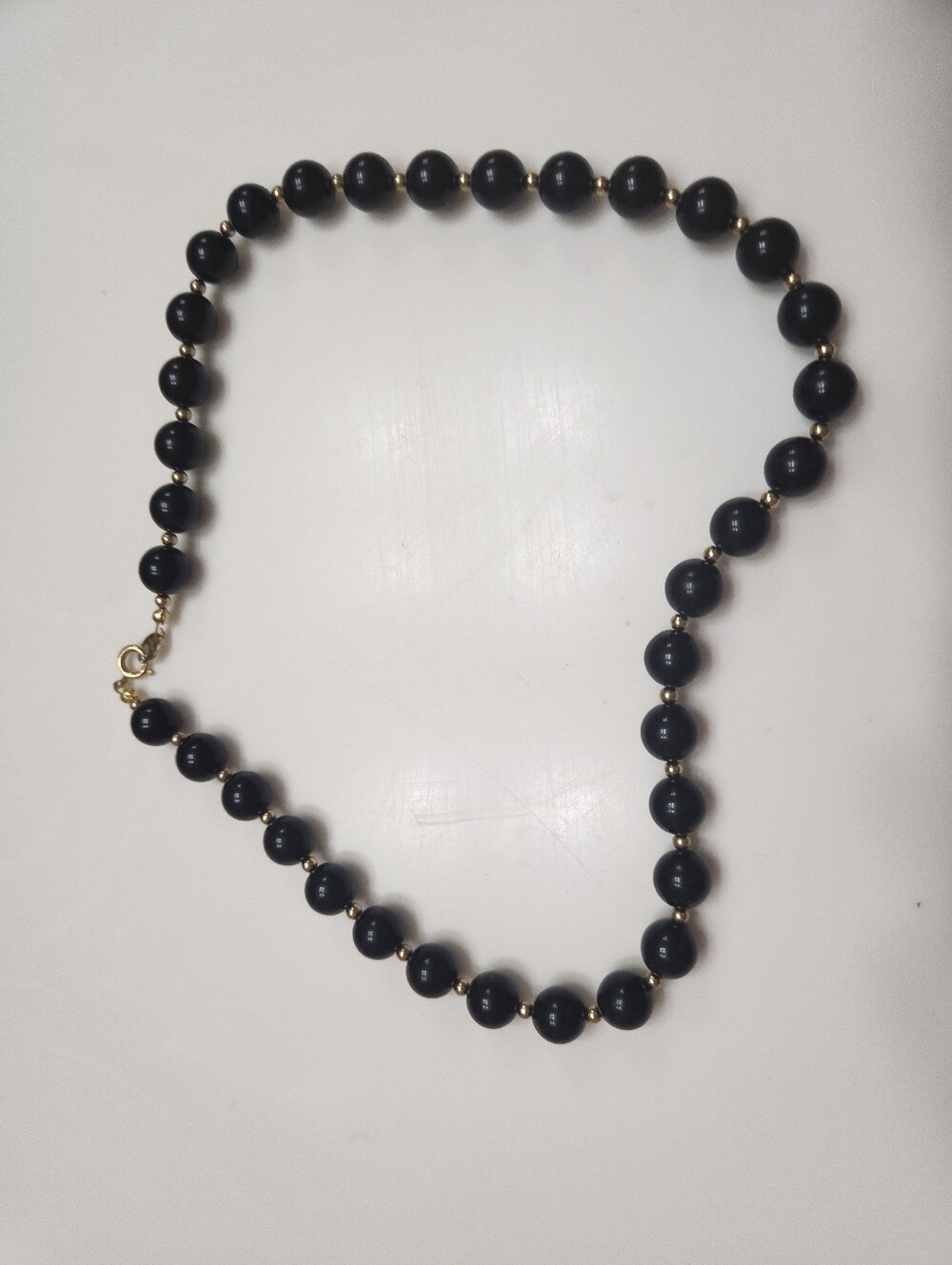 vintage black beaded strand necklace accented with tiny metallic spacer beads an
